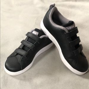 Boy’s black Adidas sneakers